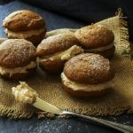 Spiced Pumpkin Whoopie Pies | The Chunky Chef | Soft and light spiced pumpkin cookies sandwiched together with a decadent, yet easy to make, browned butter maple cinnamon frosting!