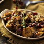 Harvest Apple Cranberry and Sage Sausage Stuffing | The ultimate sausage stuffing recipe for Thanksgiving! All your favorite Fall flavors are baked together in a perfectly textured side dish you'll love!