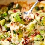 Cheesy Brussels Sprouts with Bacon | These Brussels sprouts are sautéed with shallots and garlic, topped with cream, two types of cheese, sprinkled with bacon, and baked until bubbly. It will convert even the most die hard Brussels sprouts haters! | http://thechunkychef.com