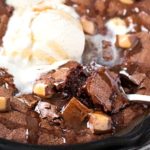 Rolo-Stuffed Skillet Brownie | This one bowl brownie recipe is made in a skillet, stuffed with rolo candies and Hershey bar pieces, and baked until warm and fudgy! | http://thechunkychef.com