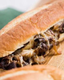 Juicy ribeye steak, caramelized onions and mushrooms, gooey provolone cheese and a mouthwatering horseradish sauce... it's the perfect All-American Cheesesteak! | #cheesesteak #phillycheesesteak #hoagie #sandwich
