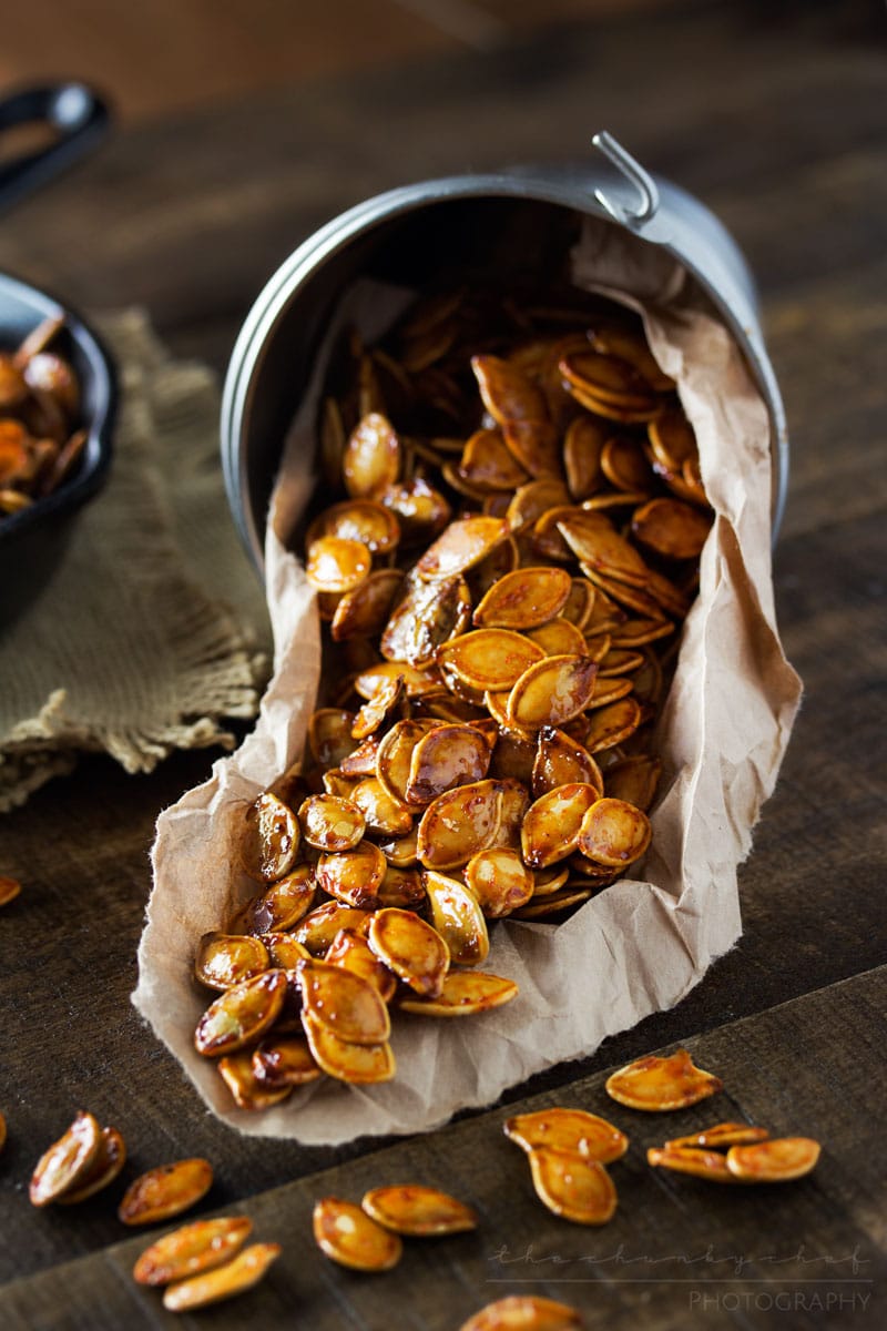 Spiced Honey Roasted Pumpkin Seeds | Waste not, want not... turn leftover pumpkins into a delicious treat! These roasted pumpkin seeds are deliciously savory, with hints of spice and honey!