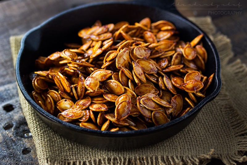 Spiced Honey Roasted Pumpkin Seeds | Waste not, want not... turn leftover pumpkins into a delicious treat! These roasted pumpkin seeds are deliciously savory, with hints of spice and honey!