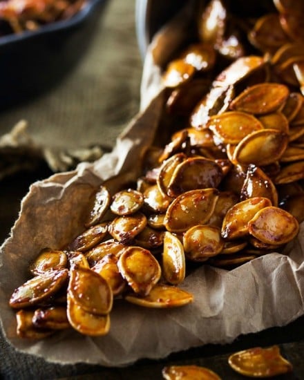 Spiced Honey Roasted Pumpkin Seeds | Waste not, want not... turn leftover pumpkins into a delicious treat! These roasted pumpkin seeds are deliciously savory, with hints of spice and honey!