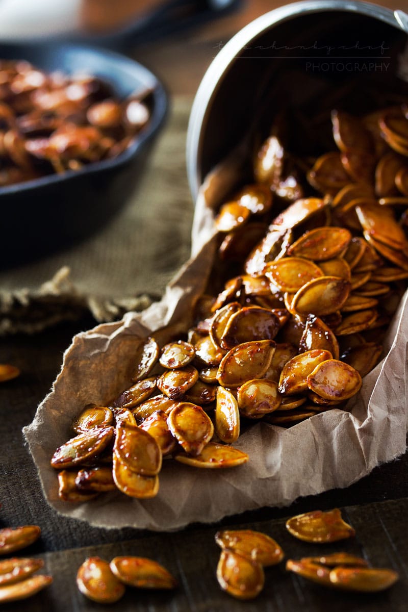 Spiced Honey Roasted Pumpkin Seeds | Waste not, want not... turn leftover pumpkins into a delicious treat! These roasted pumpkin seeds are deliciously savory, with hints of spice and honey!