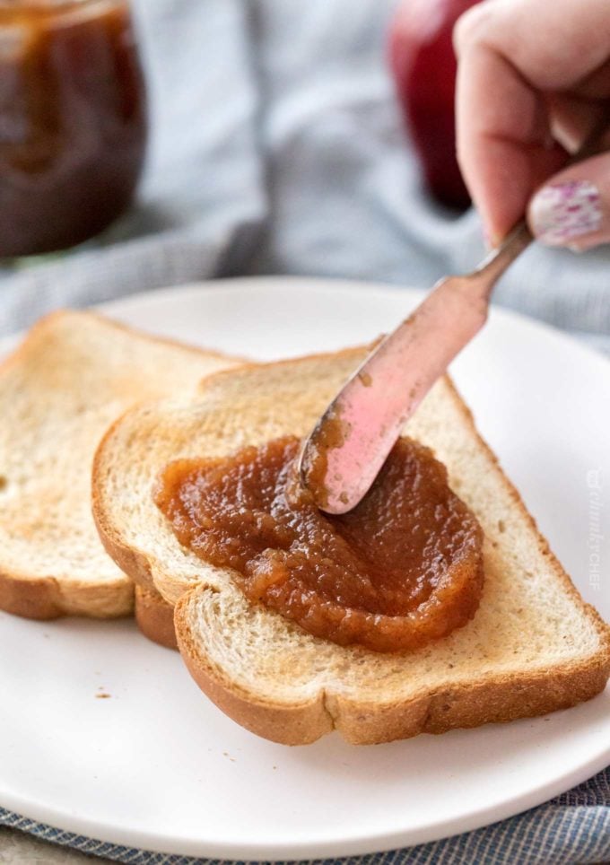 Spreading apple butter on toast