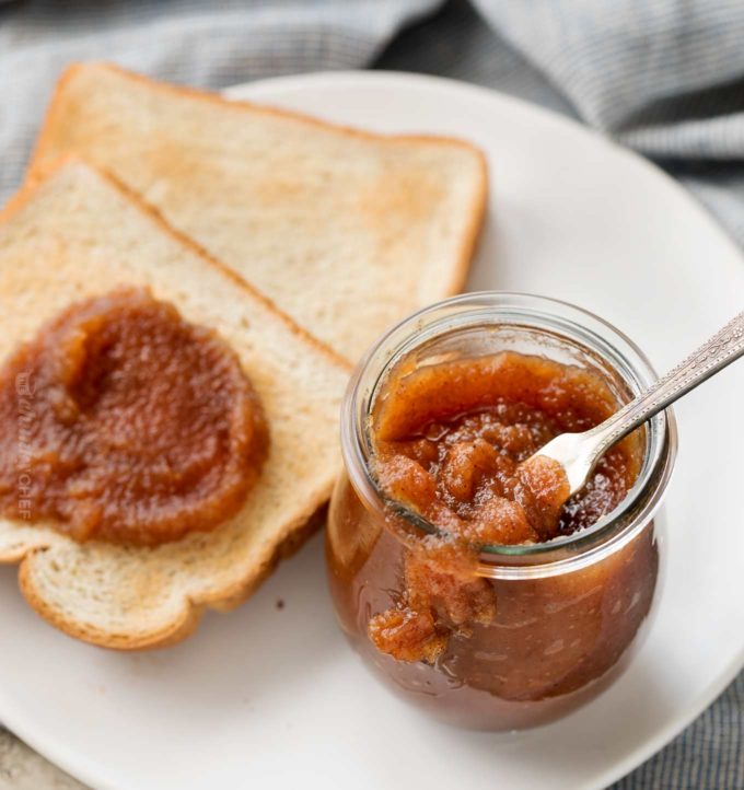 Apple butter and toast on white plate