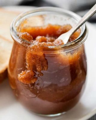 Delicious Homemade Apple Butter, made easily on the stovetop (or in the crockpot!), and ready to be slathered on just about anything! Deeply spiced and sweet, it tastes like spoonable apple pie! #applebutter #withapples #falltreat #spicedapples #applepie #homemade #easyrecipe #apples #crockpot #stovetop #slowcooker