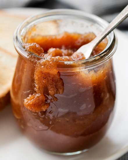 Delicious Homemade Apple Butter, made easily on the stovetop (or in the crockpot!), and ready to be slathered on just about anything!  Deeply spiced and sweet, it tastes like spoonable apple pie! #applebutter #withapples #falltreat #spicedapples #applepie #homemade #easyrecipe #apples #crockpot #stovetop #slowcooker