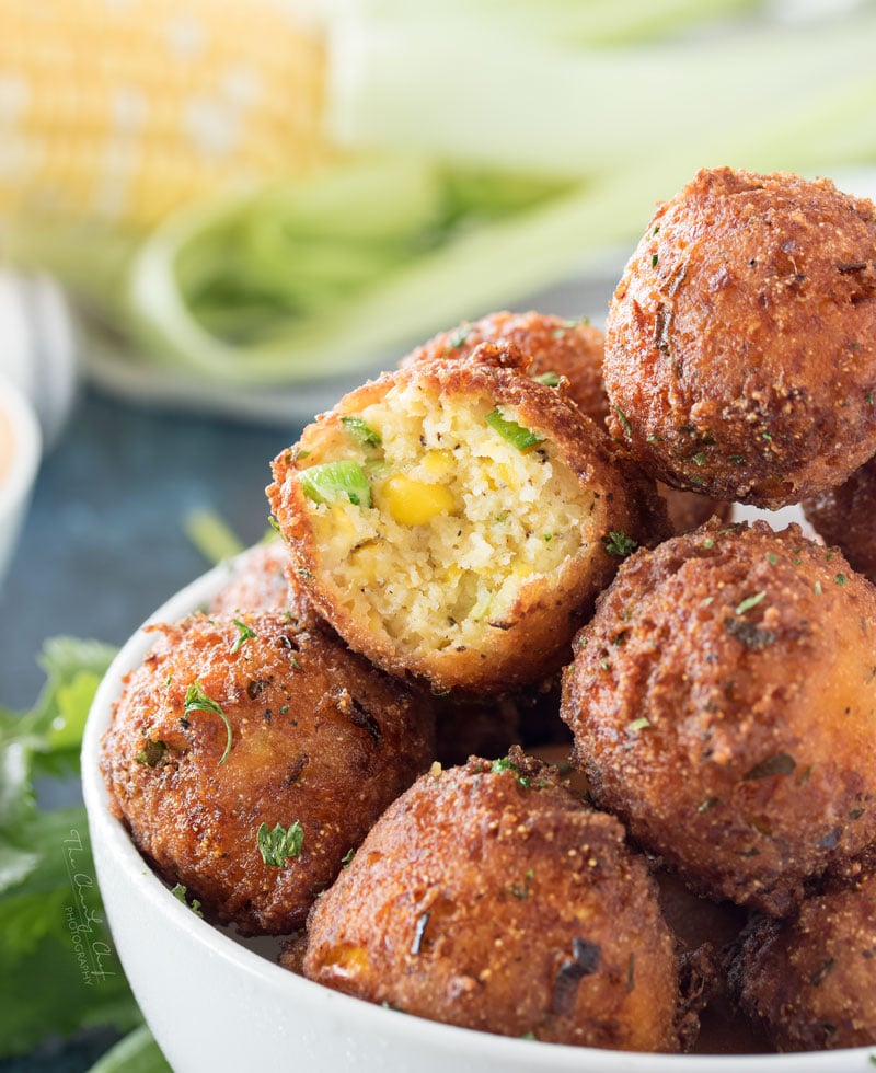 Corn Fritters with Honey Sriracha Aioli | A perfect blend of sweet and savory, these fluffy fritters are packed with flavor, fried to crispy perfection, and served with a spicy honey sriracha aioli. | http://thechunkychef.com