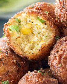 Corn Fritters with Honey Sriracha Aioli | A perfect blend of sweet and savory, these fluffy fritters are packed with flavor, fried to crispy perfection, and served with a spicy honey sriracha aioli. | http://thechunkychef.com