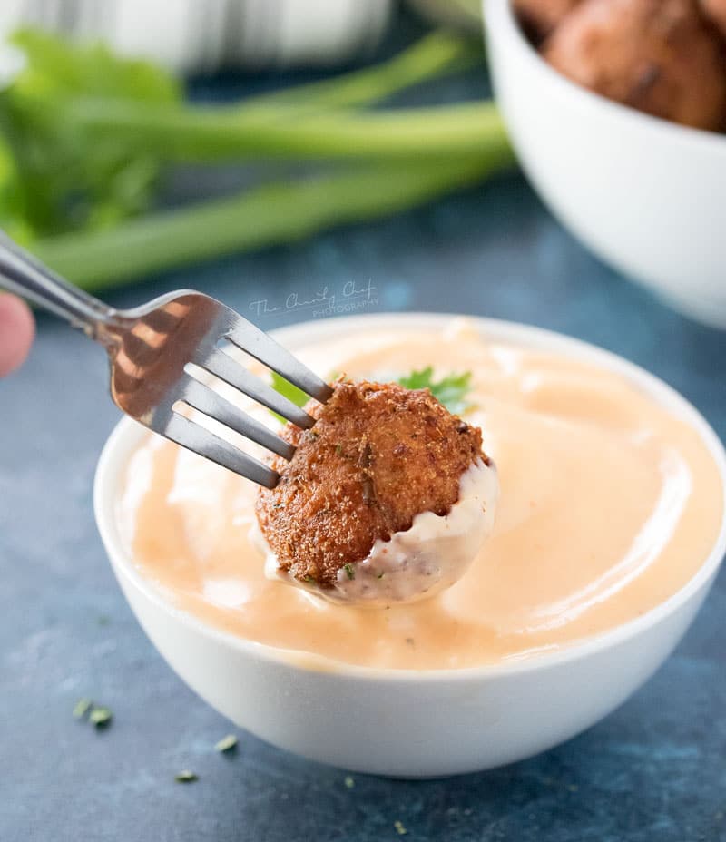 Corn Fritters with Honey Sriracha Aioli | A perfect blend of sweet and savory, these fluffy fritters are packed with flavor, fried to crispy perfection, and served with a spicy honey sriracha aioli. | http://thechunkychef.com