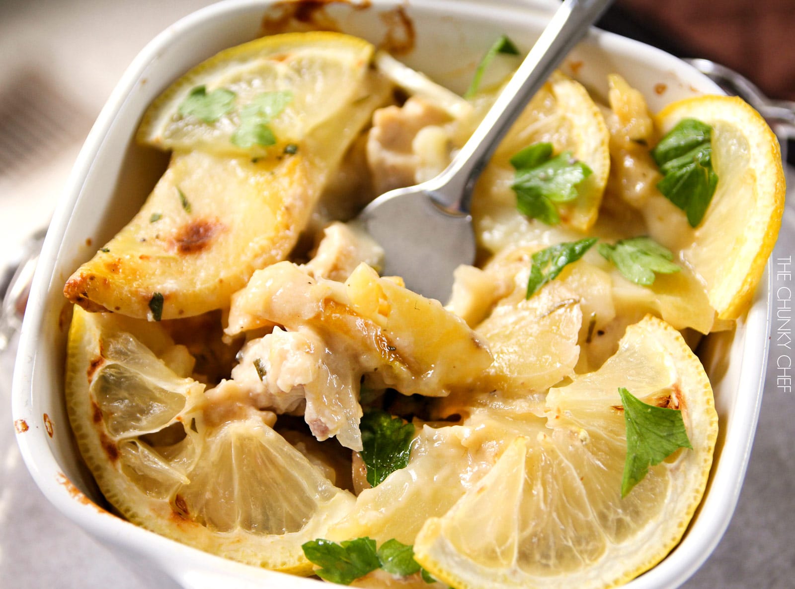 Lemon Chicken and Potato Bake | Chicken and potatoes are baked with lemon slices in a creamy casserole that's sure to fill you up and make you smile! | http://thechunkychef.com