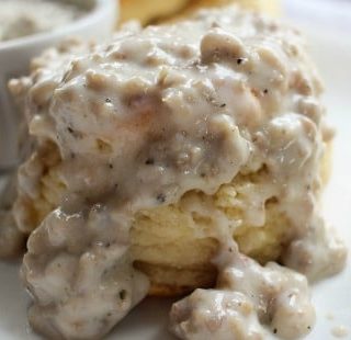 Buttermilk Biscuits and Gravy | Soft and fluffy buttermilk biscuits, perfectly big yet light at the same time, smothered with a creamy homemade sausage gravy... classic down home cooking! |http://thechunkychef.com
