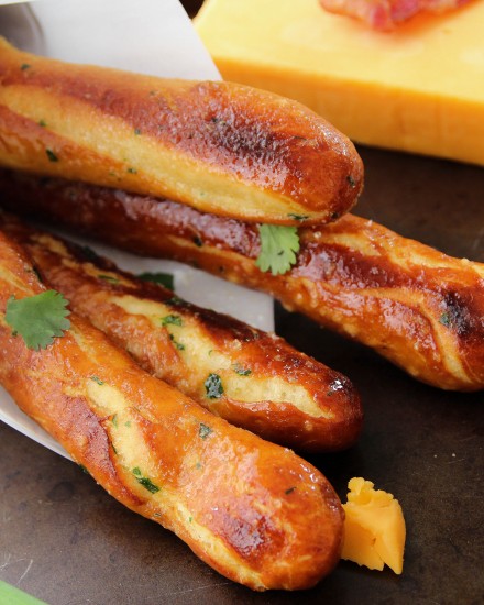 Baked Soft Pretzel Sticks - Soft, tender, buttery and brushed with a garlic and herb butter... these soft pretzel sticks from scratch taste amazingly good!