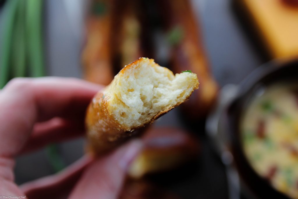 Baked Soft Pretzel Sticks - Soft, tender, buttery and brushed with a garlic and herb butter... these soft pretzel sticks from scratch taste amazingly good!