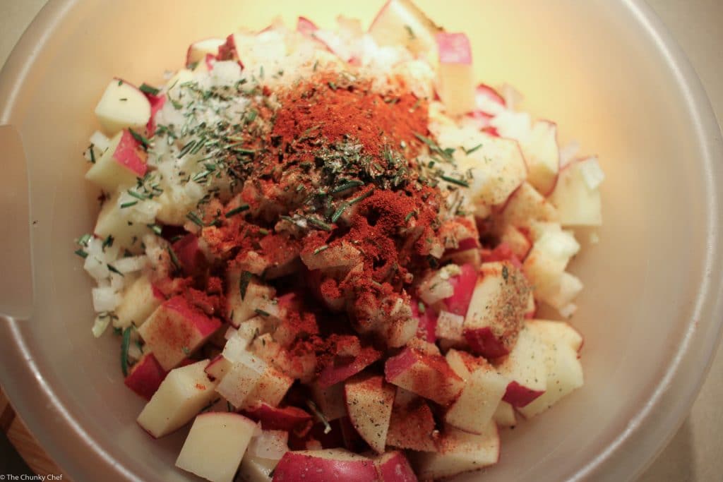 Perfectly seasoned and roasted red-skin potatoes topped with caramelized onions, crispy bacon and fresh herbs. The perfect side dish for breakfast!