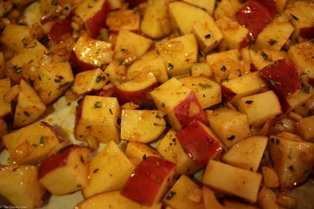 Perfectly seasoned and roasted red-skin potatoes topped with caramelized onions, crispy bacon and fresh herbs. The perfect side dish for breakfast!