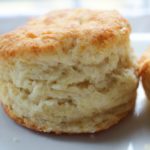 Soft and fluffy buttermilk biscuits, perfectly big yet light at the same time, smothered with a creamy homemade sausage gravy... classic down home cooking!