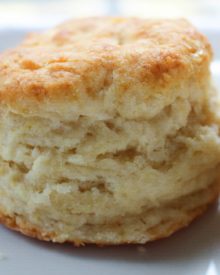 Soft and fluffy buttermilk biscuits, perfectly big yet light at the same time, smothered with a creamy homemade sausage gravy... classic down home cooking!