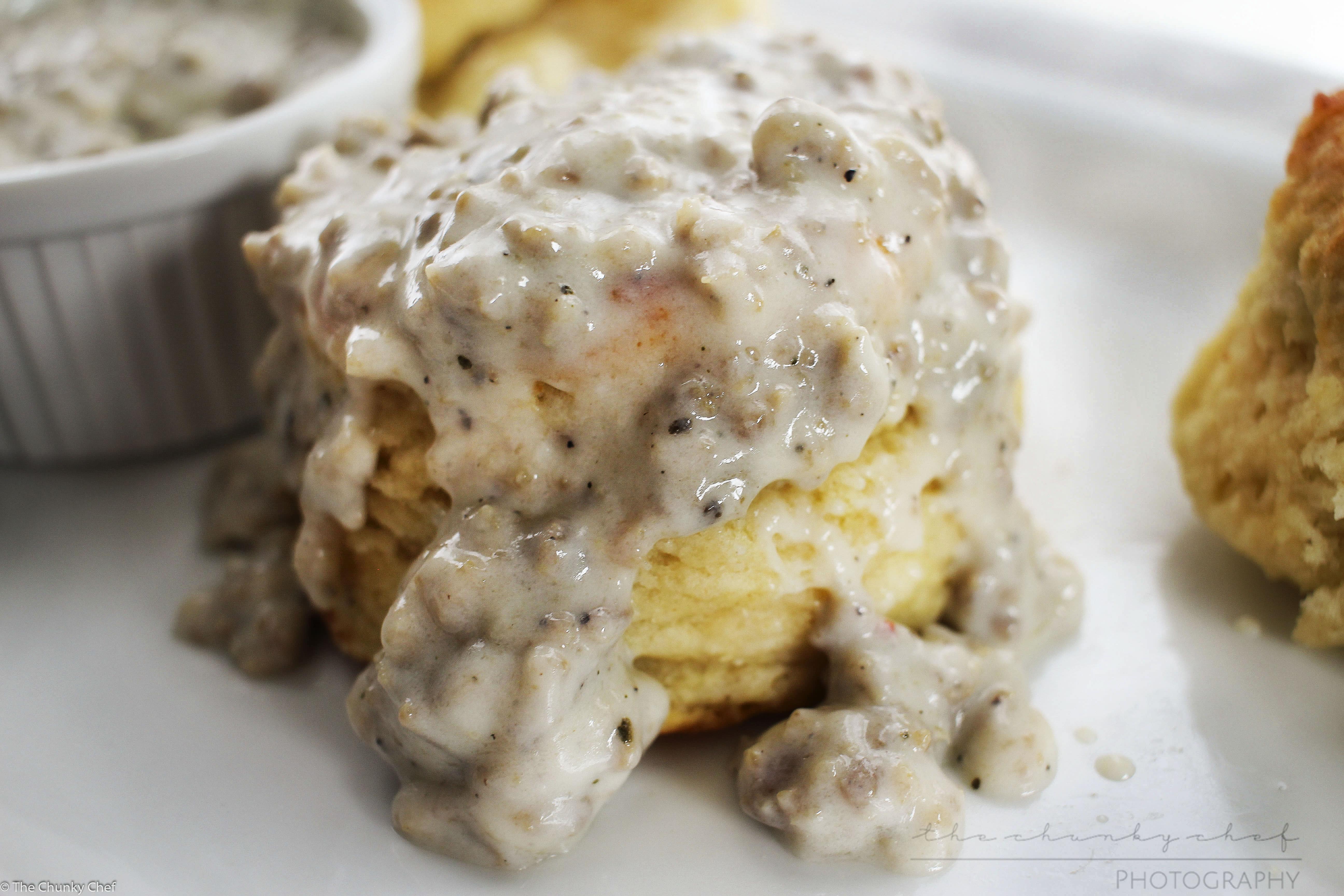 Soft and fluffy buttermilk biscuits, perfectly big yet light at the same time, smothered with a creamy homemade sausage gravy... classic down home cooking!