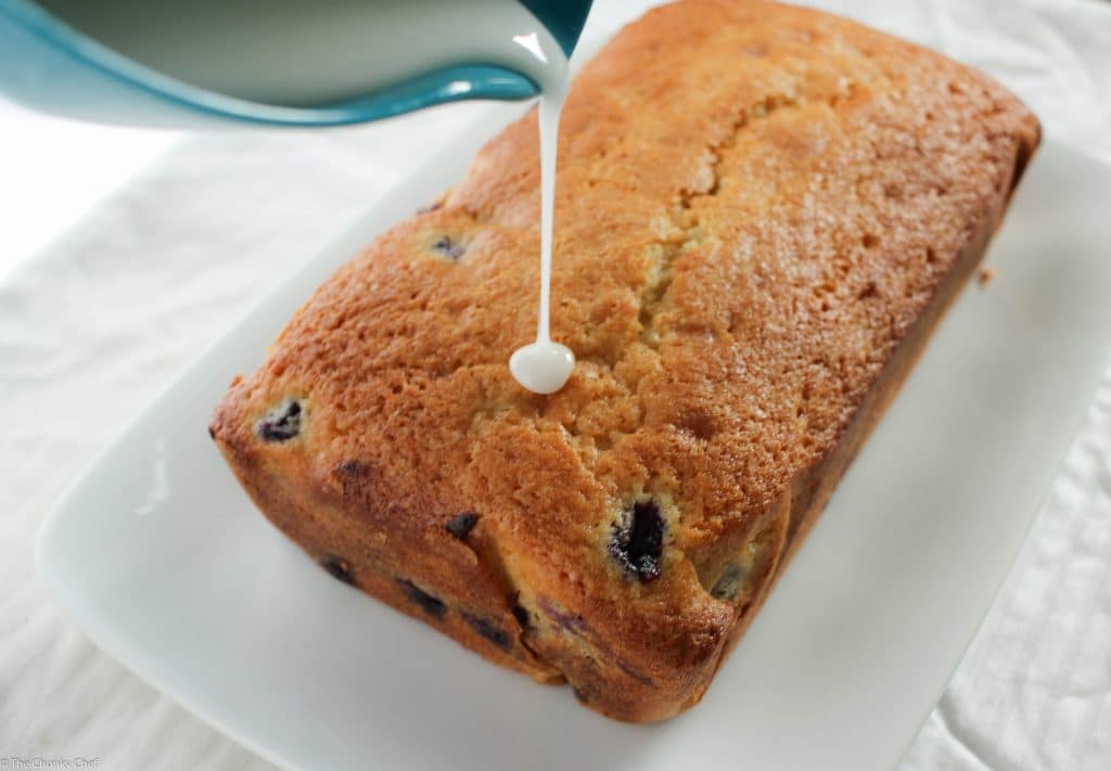 Blueberry Lemon Bread - Sweet bread studded with fresh blueberries, hints of lemon, and drizzled with a decadent lemon cream cheese glaze