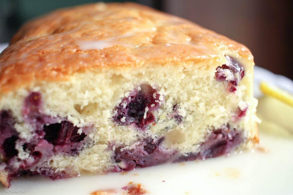 Blueberry Lemon Bread - Sweet bread studded with fresh blueberries, hints of lemon, and drizzled with a decadent lemon cream cheese glaze