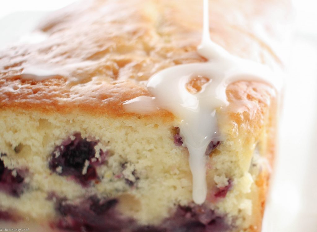 Blueberry Lemon Bread - Sweet bread studded with fresh blueberries, hints of lemon, and drizzled with a decadent lemon cream cheese glaze