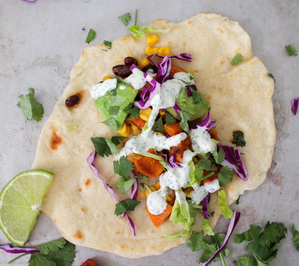 An absolutely delicious vegetarian soft taco that even meat-eaters will LOVE! Sweet potatoes mixed with protein packed black beans make these extra hearty!