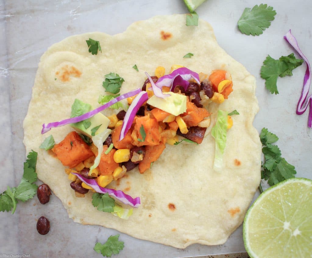 An absolutely delicious vegetarian soft taco that even meat-eaters will LOVE! Sweet potatoes mixed with protein packed black beans make these extra hearty!