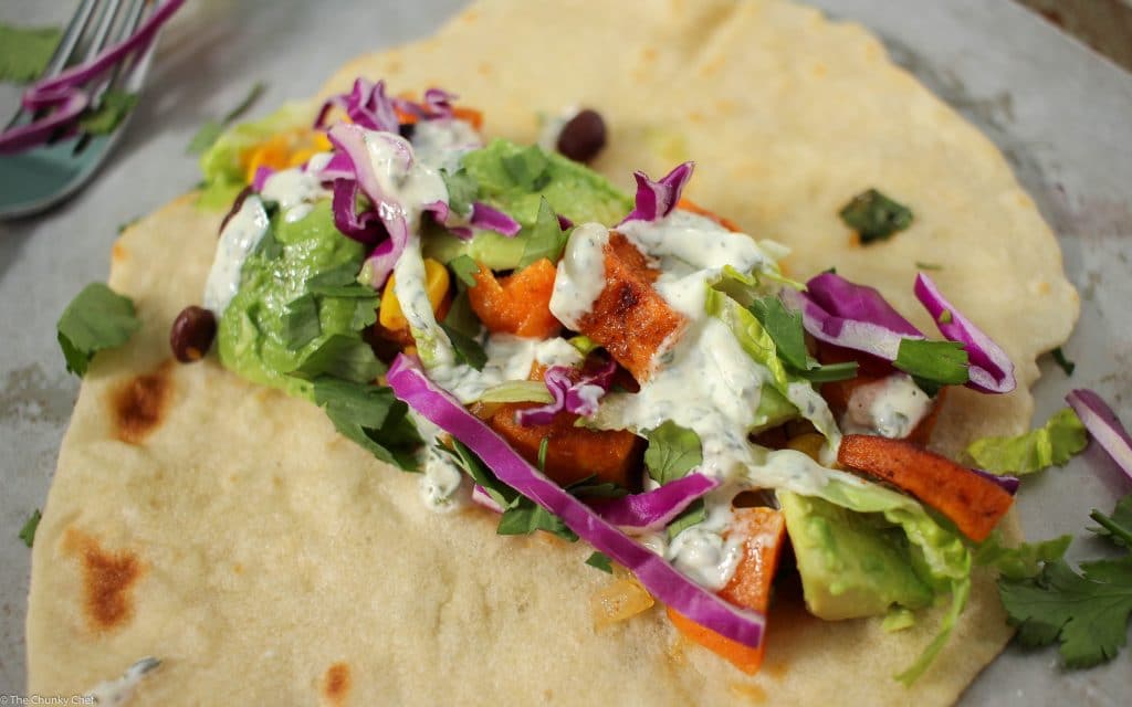 An absolutely delicious vegetarian soft taco that even meat-eaters will LOVE! Sweet potatoes mixed with protein packed black beans make these extra hearty!