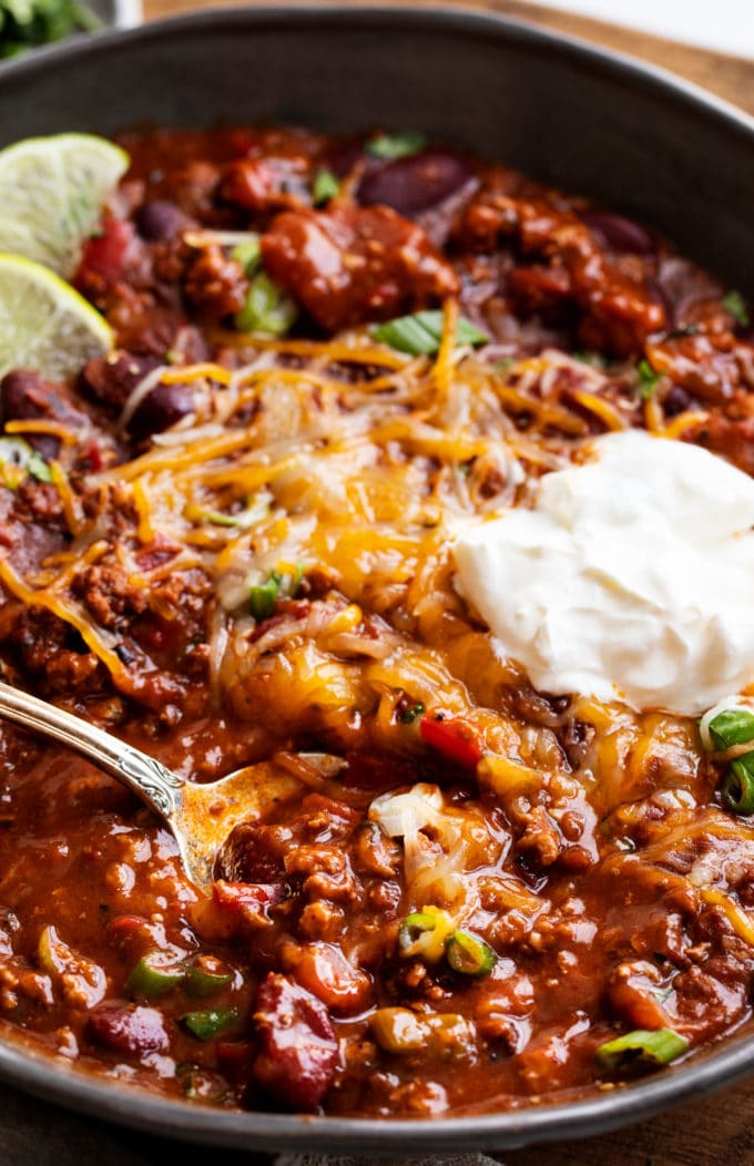 Rich hearty chili, made with beef or turkey!  Since it's made in the Instant Pot, it tastes like it simmered for hours - yet it's ready in 40 minutes! #instantpot #pressurecooker #chili #chilirecipe #beef #turkey #comfortfood #dinner #easyrecipe #beans