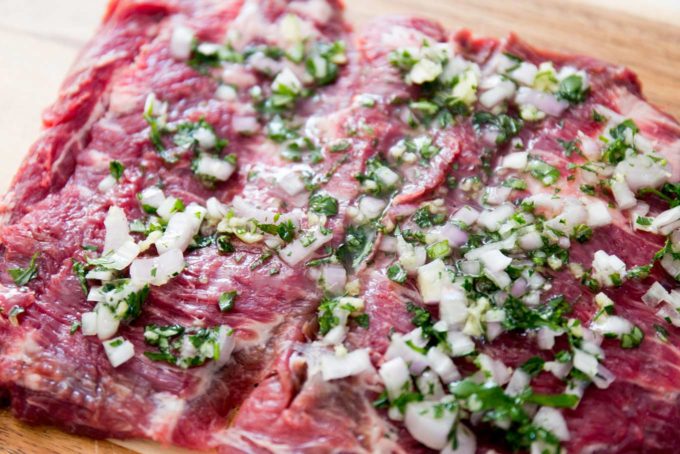 Butterflied flank steak with garlic herb mixture