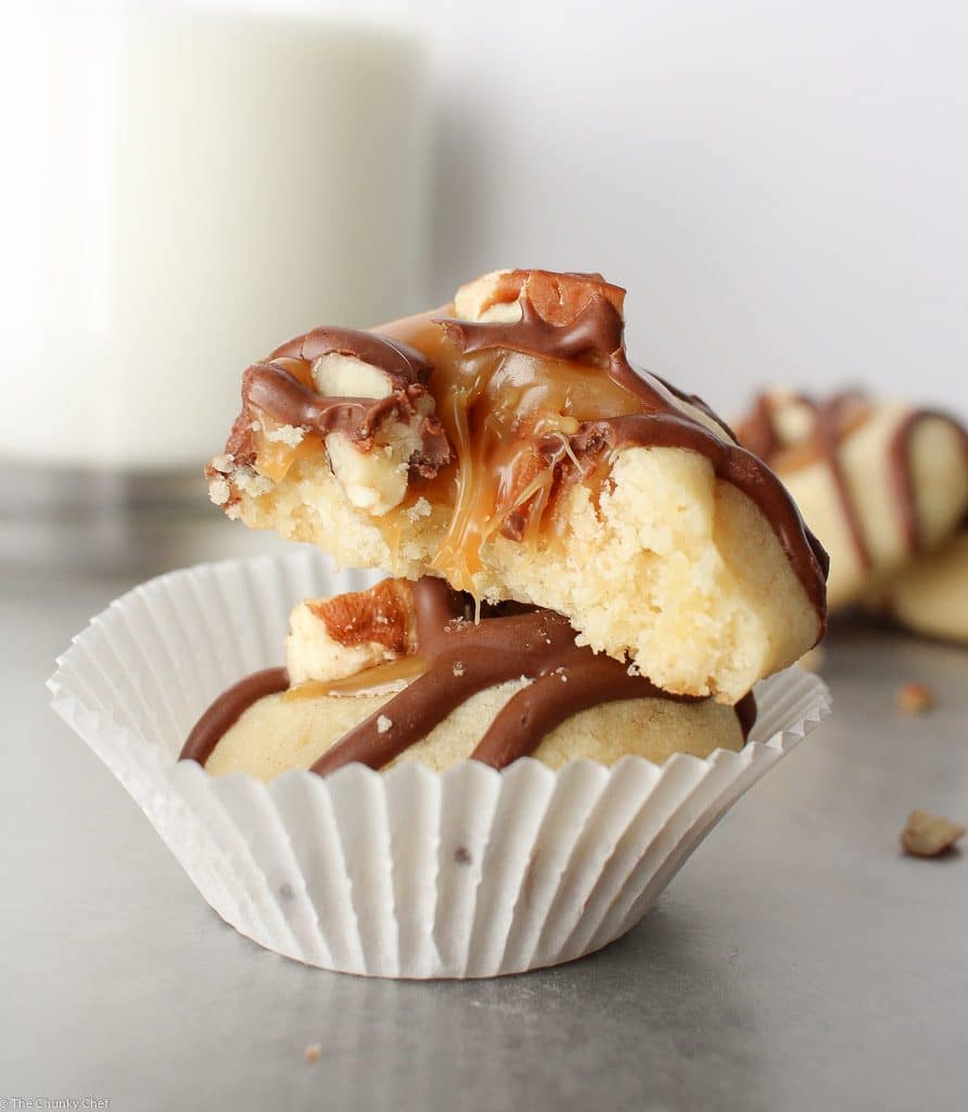 Thumbprint cookies are such a classic... this spin on them includes a gooey caramel center and drizzled melted chocolate. Tastes just like a Twix!