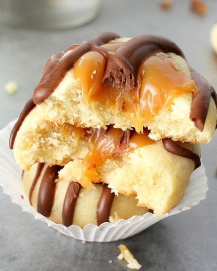 Turtle Twix Thumbprint Cookies | The Chunky Chef | Thumbprint cookies are such a classic... this spin on them includes a gooey caramel center and drizzled melted chocolate. Tastes just like a Twix!