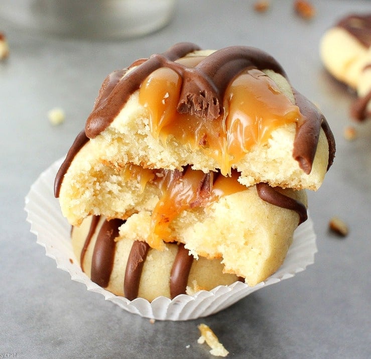 Turtle Twix Thumbprint Cookies | The Chunky Chef | Thumbprint cookies are such a classic... this spin on them includes a gooey caramel center and drizzled melted chocolate. Tastes just like a Twix!