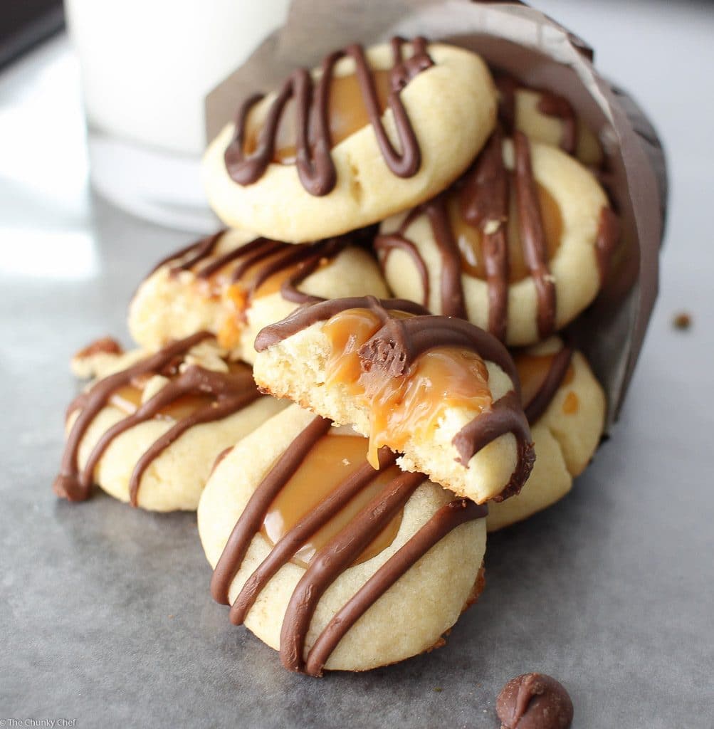 Thumbprint cookies are such a classic... this spin on them includes a gooey caramel center and drizzled melted chocolate. Tastes just like a Twix!