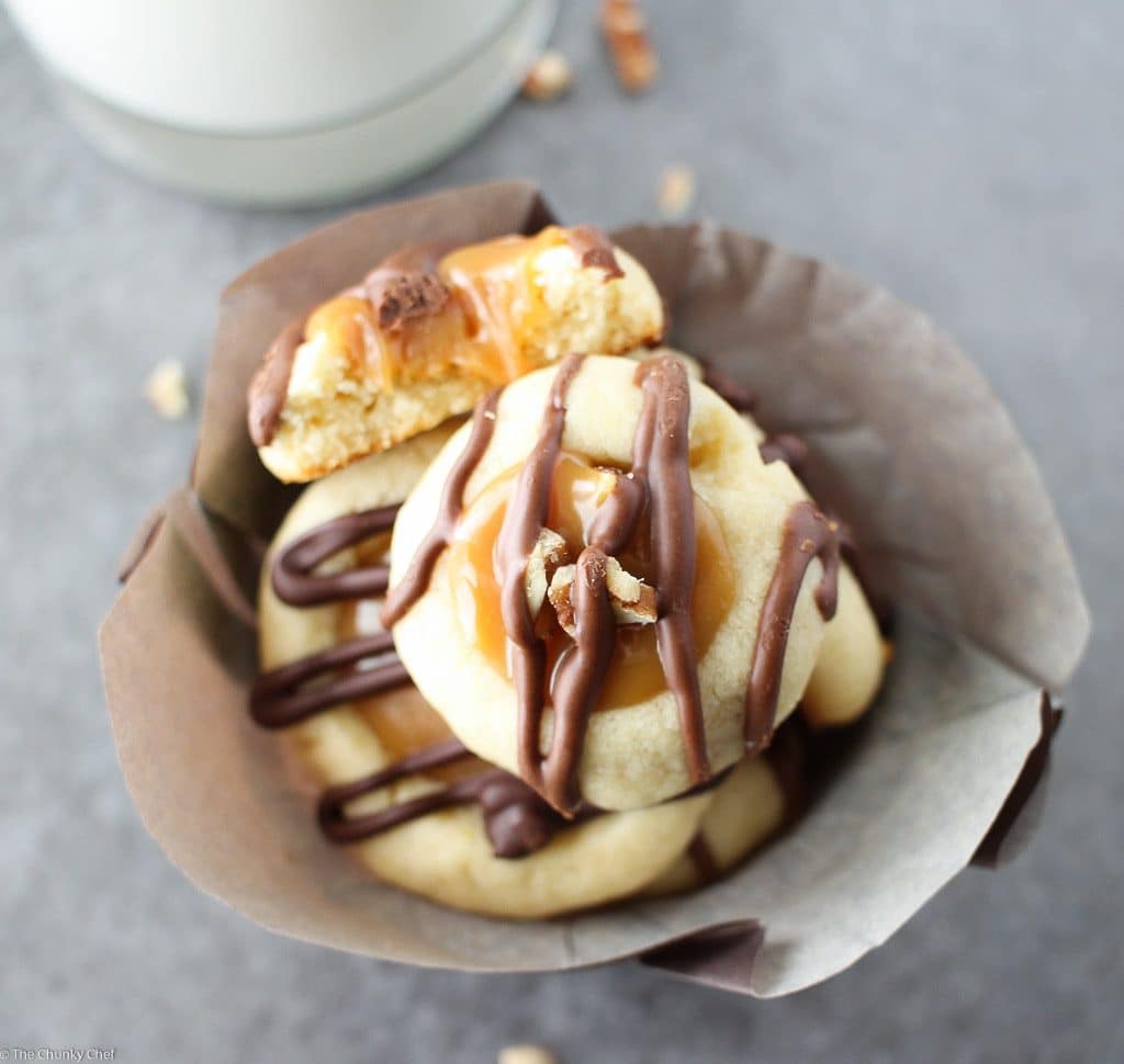 Thumbprint cookies are such a classic... this spin on them includes a gooey caramel center and drizzled melted chocolate. Tastes just like a Twix!