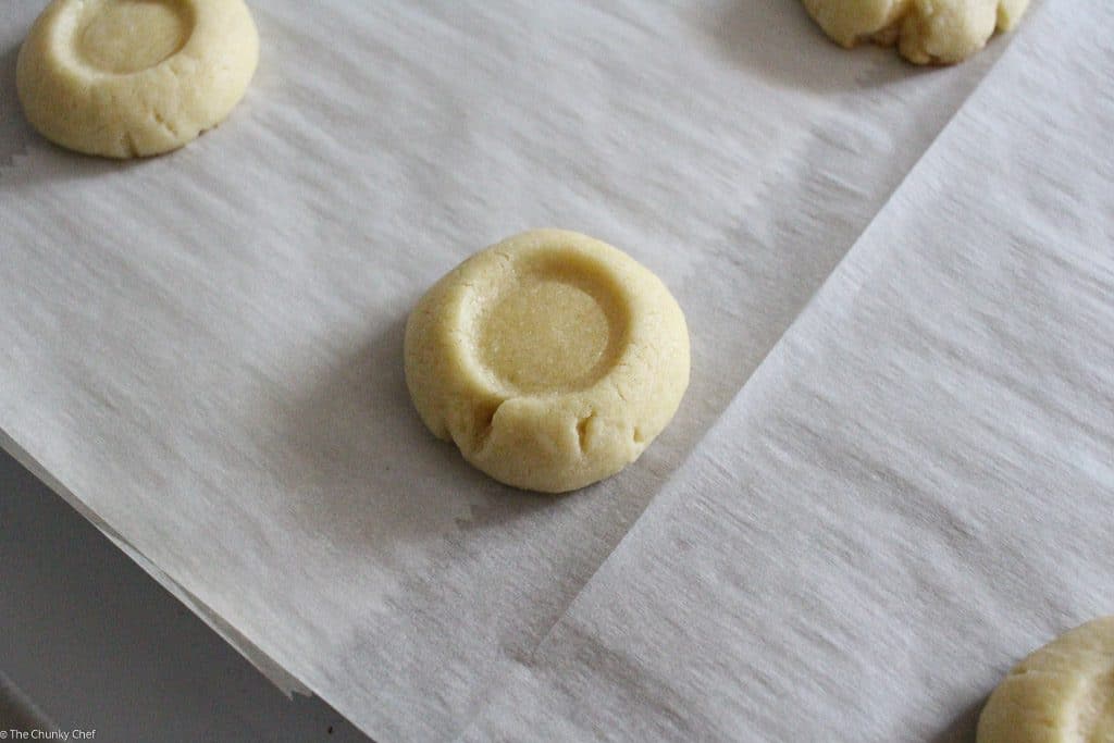 Thumbprint cookies are such a classic... this spin on them includes a gooey caramel center and drizzled melted chocolate. Tastes just like a Twix!