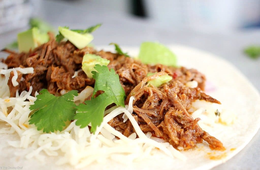 Perfect for Cinco de Mayo or any other occasion... these shredded beef tacos are amazing! The slow cooker makes these so tender and flavorful!