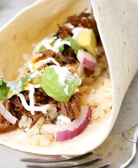 Perfect for Cinco de Mayo or any other occasion... these shredded beef tacos are amazing! The slow cooker makes these so tender and flavorful!