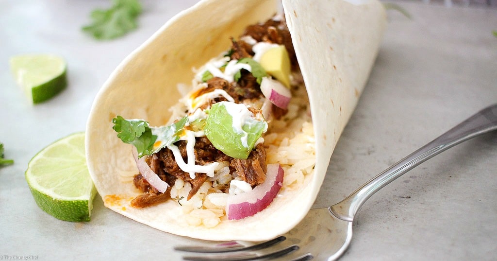 Perfect for Cinco de Mayo or any other occasion... these shredded beef tacos are amazing! The slow cooker makes these so tender and flavorful!