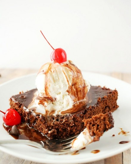 Deliciously fudgy brownies made with Coca-Cola, topped with a generous scoop of vanilla bean ice cream, and drizzled with a coca cola chocolate sauce!
