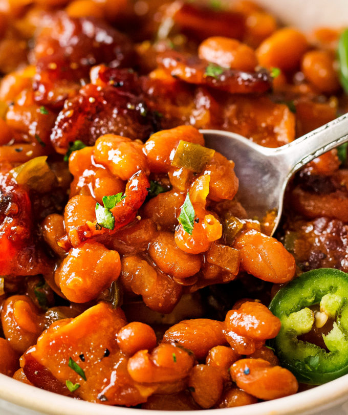 Spoonful of baked beans with jalapeno