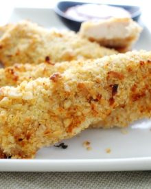 Not your run of the mill baked chicken tenders... this chicken is crusted in a delicious coconut and cashew breading and baked to golden brown perfection!