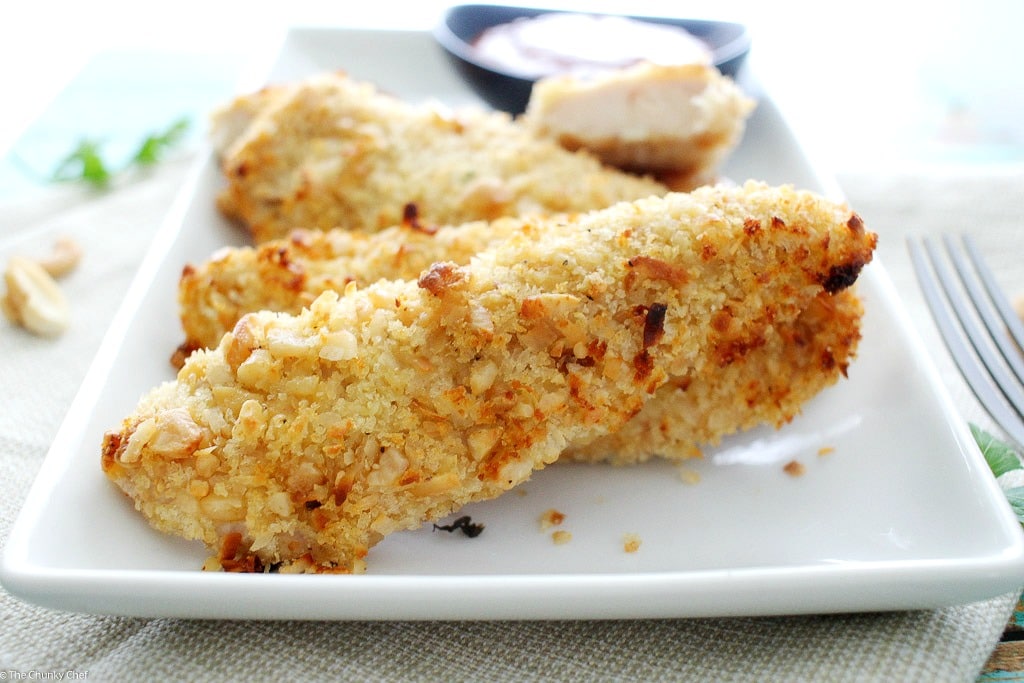 Not your run of the mill baked chicken tenders... this chicken is crusted in a delicious coconut and cashew breading and baked to golden brown perfection!