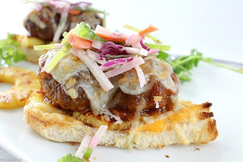 These Hawaiian meatball sliders are juicy, cheesy, sweet with a little spicy kick, and topped off with a crunchy and flavorful jicama slaw!