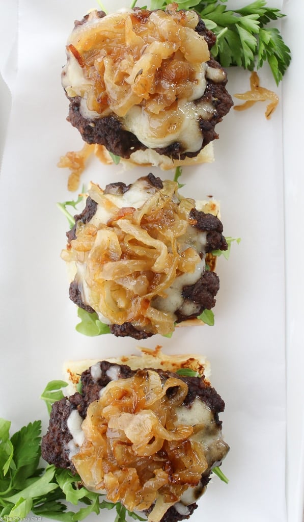 Caramelized Onion Beef Sliders | The Chunky Chef | Ground beef sliders smothered in melted gruyere cheese, topped with caramelized onions and thyme, peppered bacon and a flavorful A1 mayo!