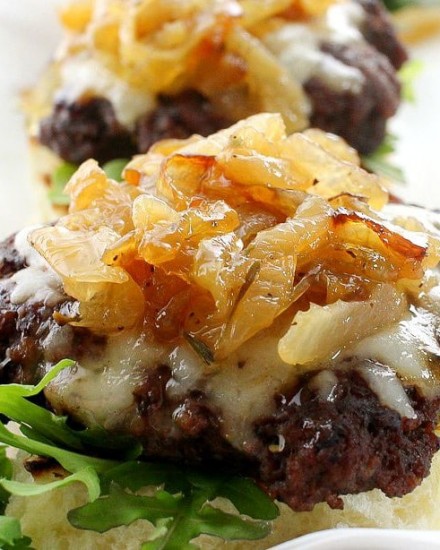 Caramelized Onion Beef Sliders | The Chunky Chef | Ground beef sliders smothered in melted gruyere cheese, topped with caramelized onions and thyme, peppered bacon and a flavorful A1 mayo!