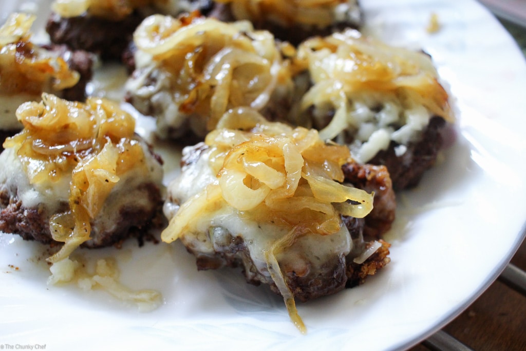 Caramelized Onion Beef Sliders | The Chunky Chef | Ground beef sliders smothered in melted gruyere cheese, topped with caramelized onions and thyme, peppered bacon and a flavorful A1 mayo!